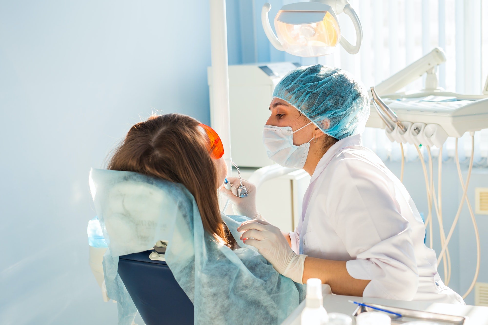 Young woman getting dental treatment. dental clinic.